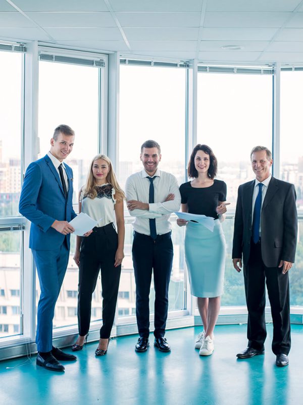 portrait-confident-businesspeople-standing-office